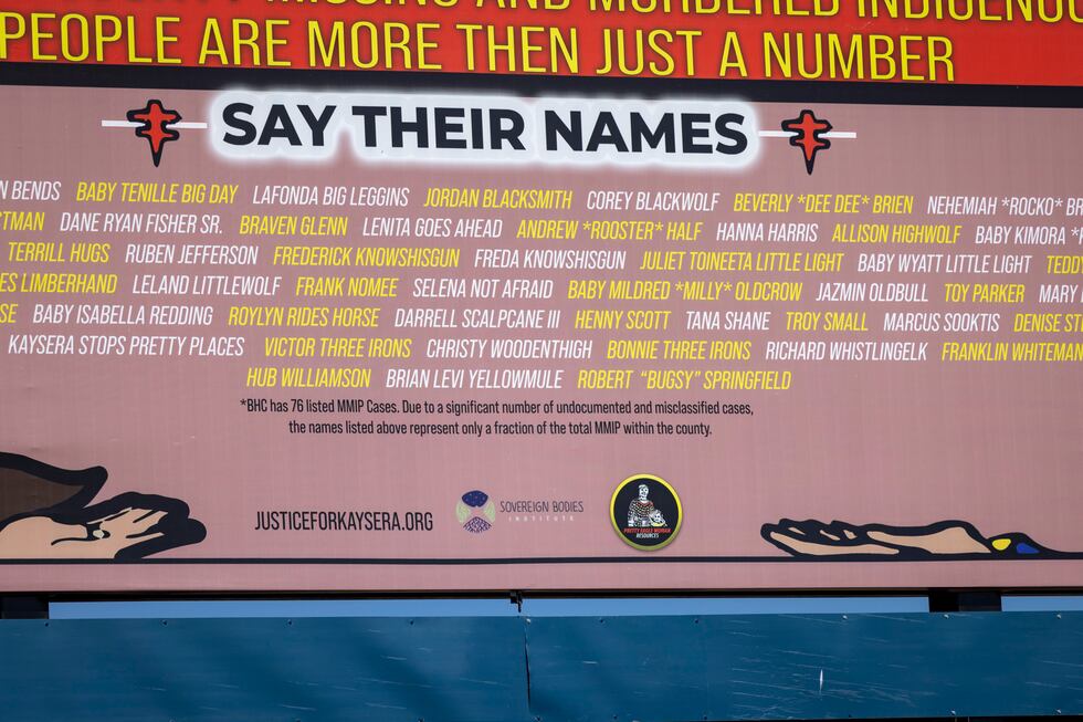 The billboard lists names of people classified as Missing and Murdered Indigenous People in...