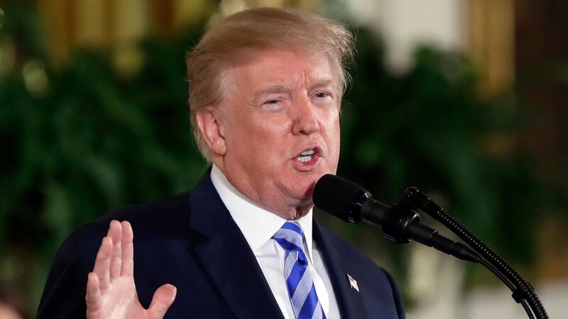 FILE - President Donald Trump speaks in the East Room of the White House in Washington on Feb....
