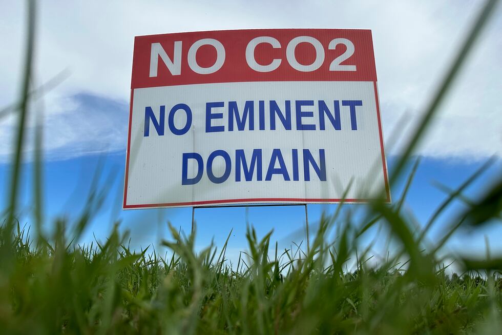 A sign reading "No CO2, no eminent domain" stands along a rural road east of Bismarck, N.D.,...