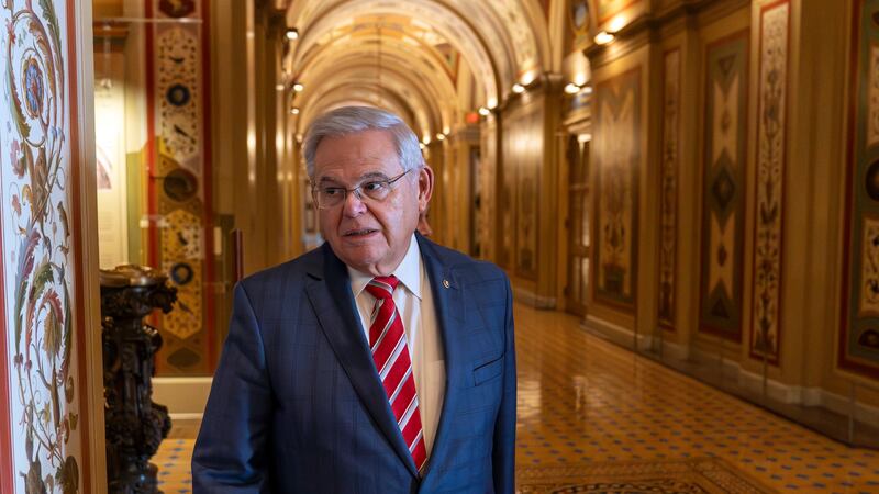 Sen. Bob Menendez, D-N.J., departs the Senate floor in the Capitol, Thursday, Sept. 28, 2023,...