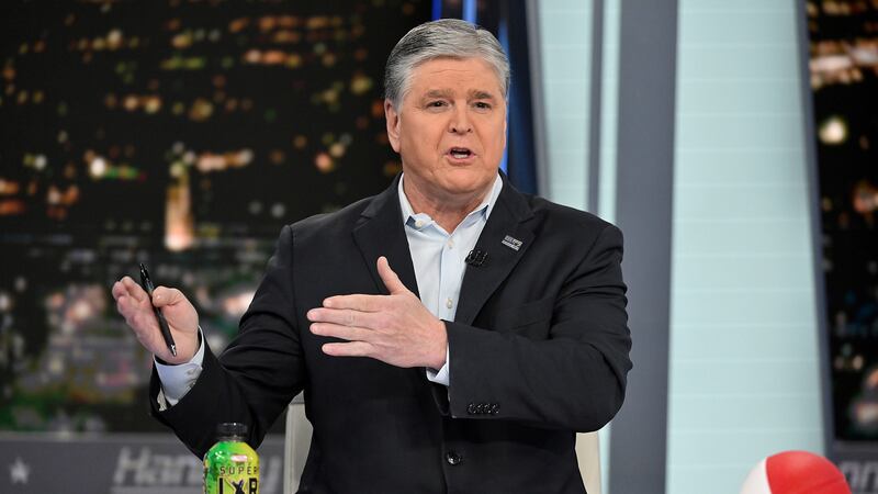 FILE - Fox News commentator Sean Hannity speaks during an interview at Fox News Studios, March...