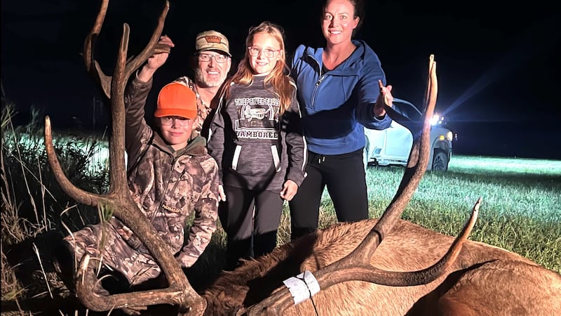 Ryker Copp and his family pose with the trophy elk he harvested Sunday in Kittson Co. near the...