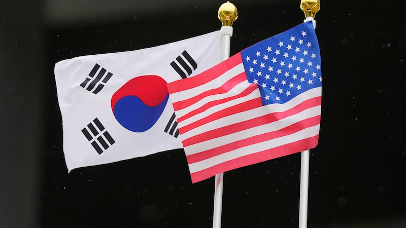FILE - Flags of South Korea and the United States flutter outside of the National Museum of...